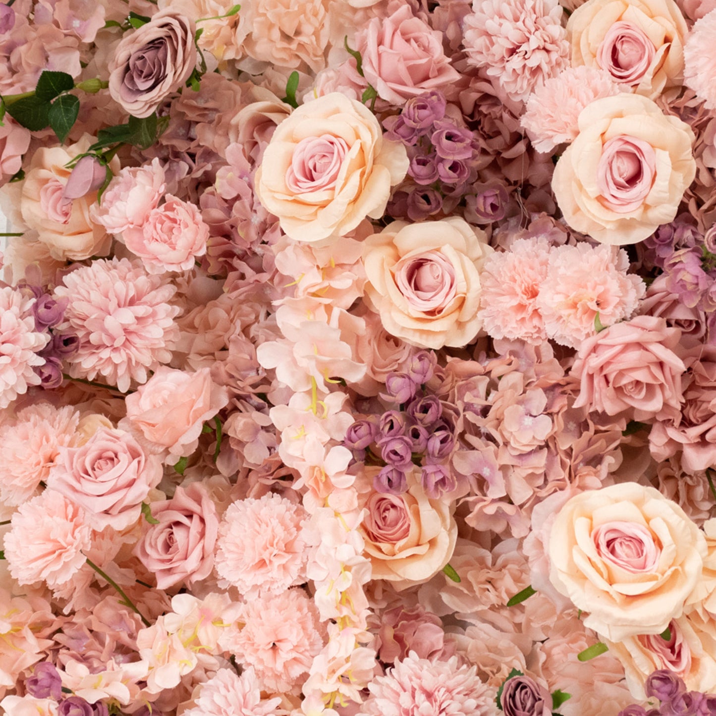 Dusty rose floral backdrop with silk roses and hydrangeas.