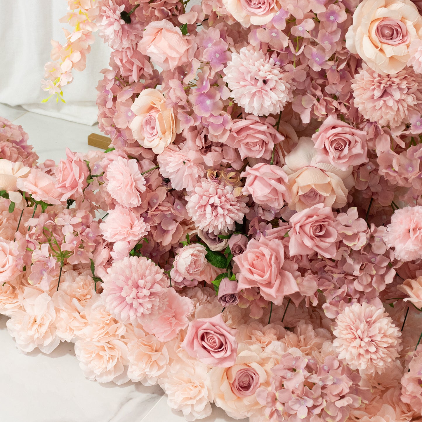 Dusty rose floral backdrop with roses, hydrangeas, and chrysanthemums.