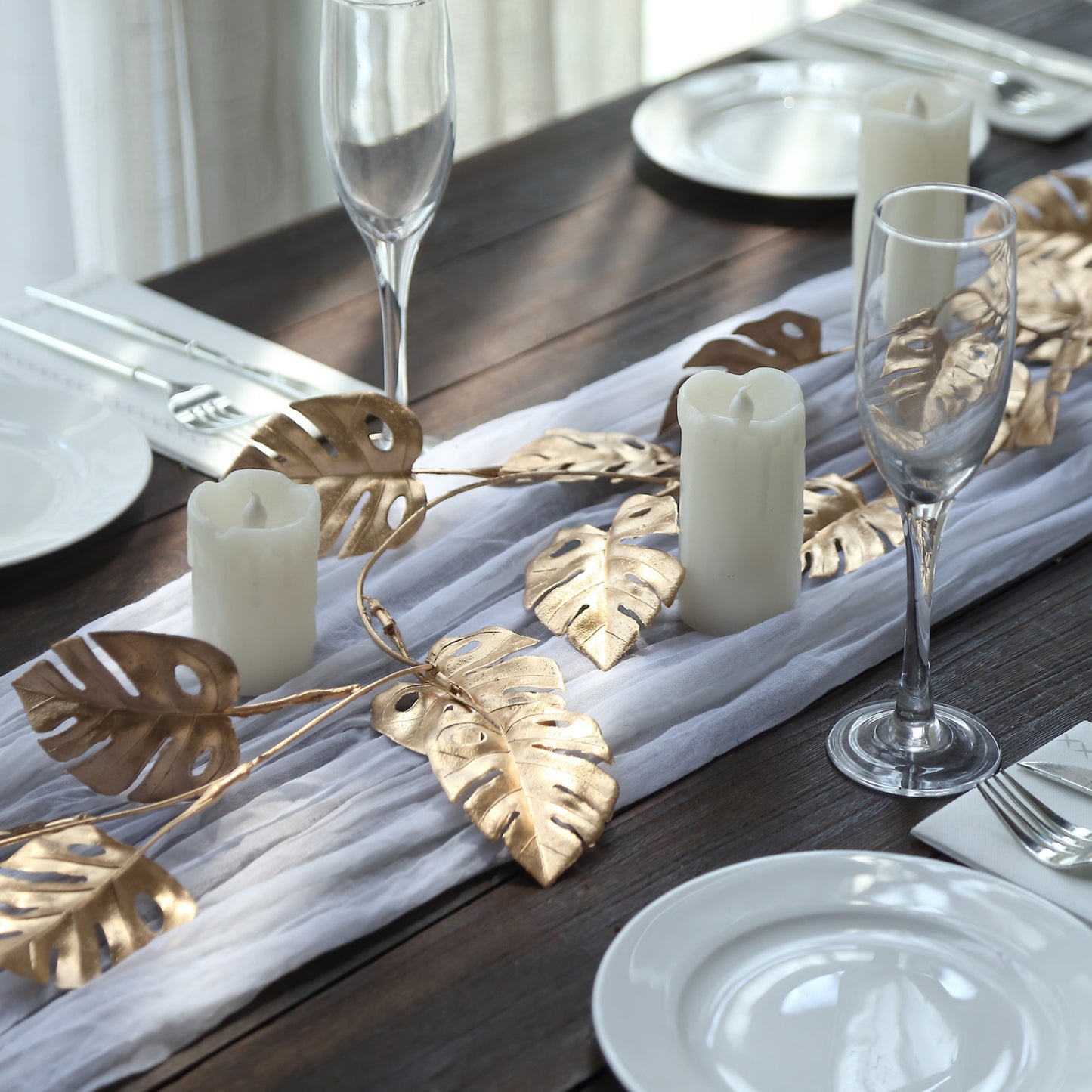 7ft metallic gold artificial monstera leaf hanging vine table garland.