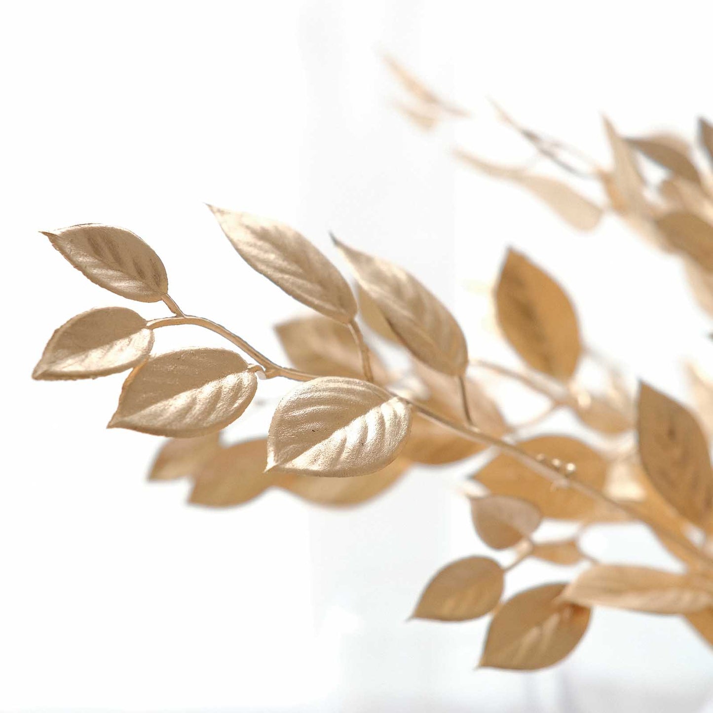 Metallic gold faux Italian ruscus leaves stems for vase fillers.