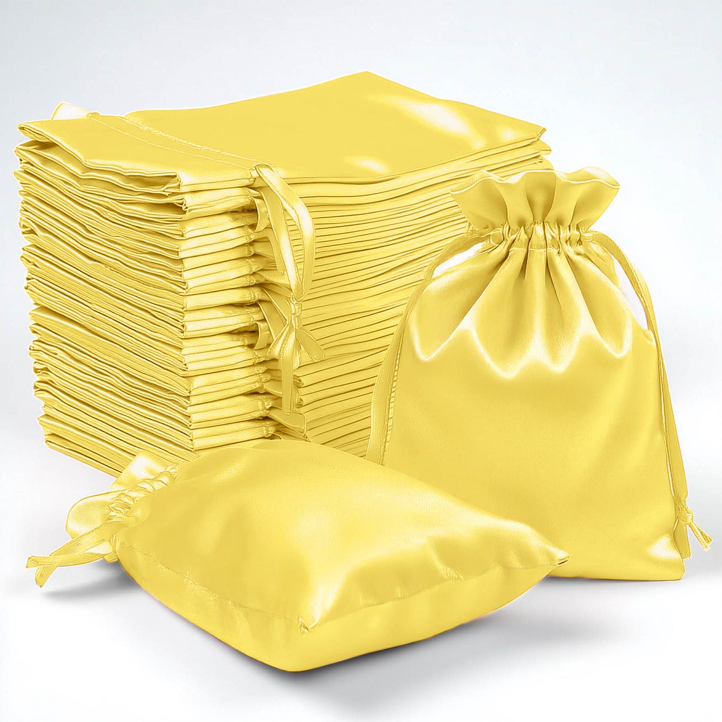 Gold satin drawstring pouch gift bags for weddings and parties.