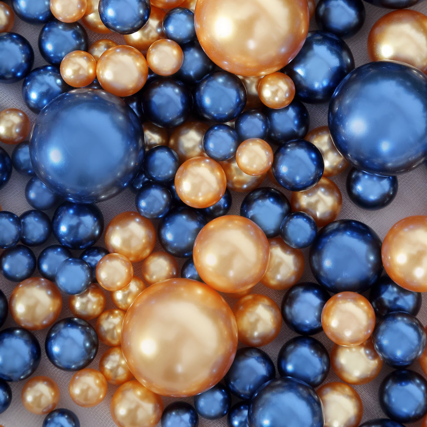 Navy blue and gold faux pearl beads for DIY crafts and vase fillers.