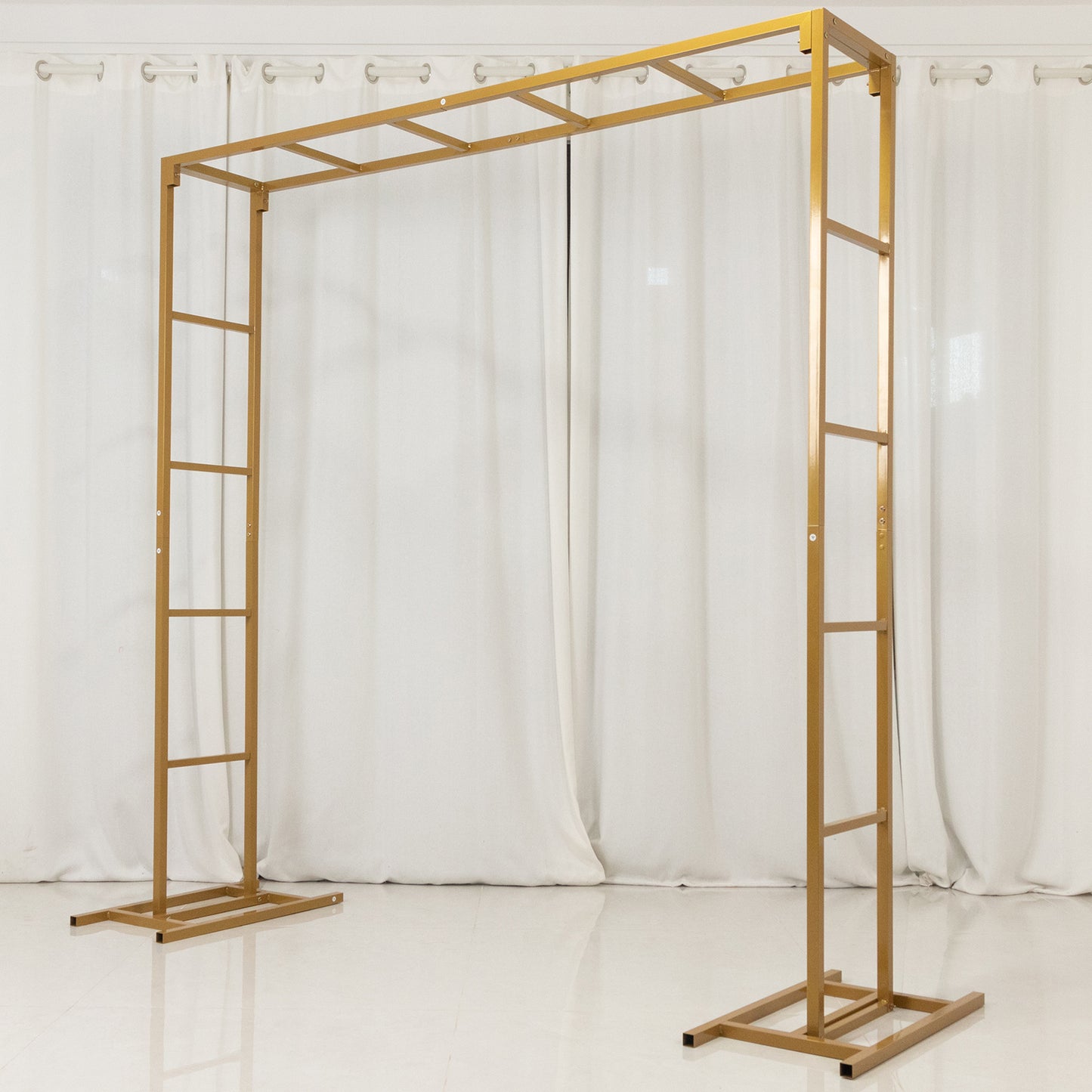 Gold square arbor backdrop stand for floral and balloon décor.