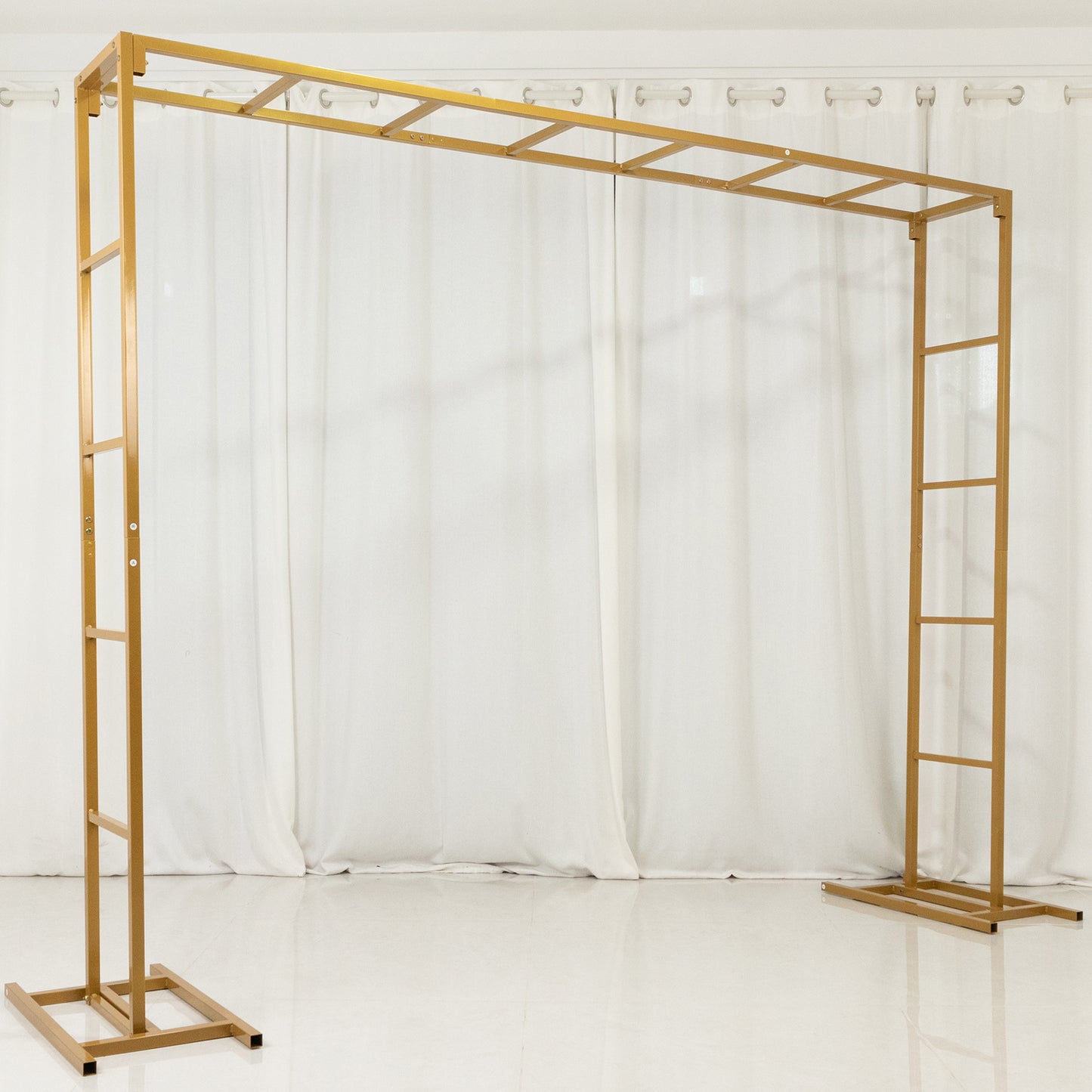 Gold rectangular freestanding arbor backdrop stand for floral and balloon décor.