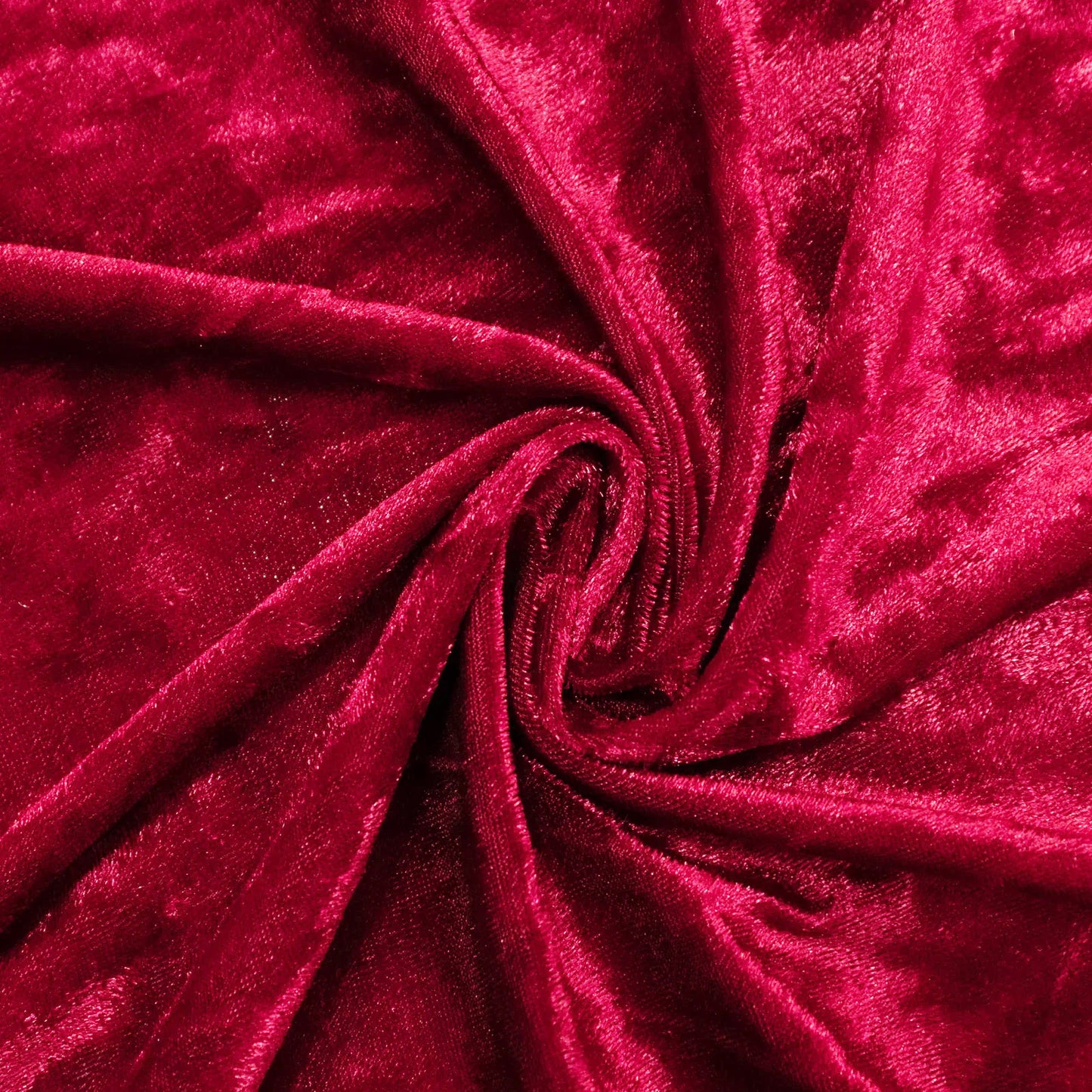 Rich red velvet fabric in a swirling pattern, perfect for upholstery and fashion. #whtbkgd