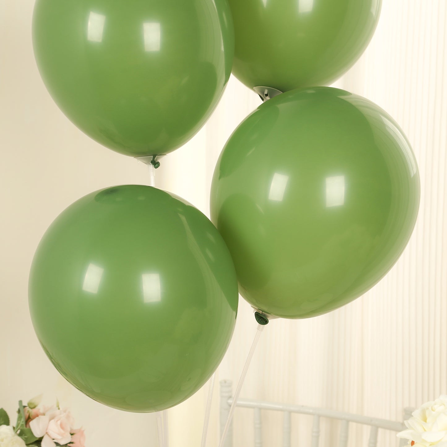 Matte pastel dusty sage green biodegradable balloons.