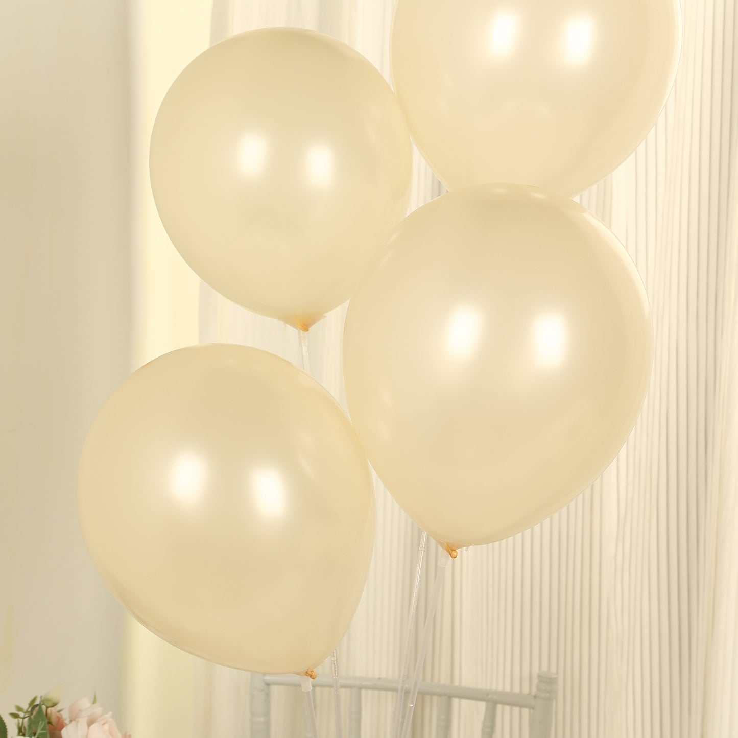 Matte pastel cream biodegradable balloons in a soft, rounded shape.