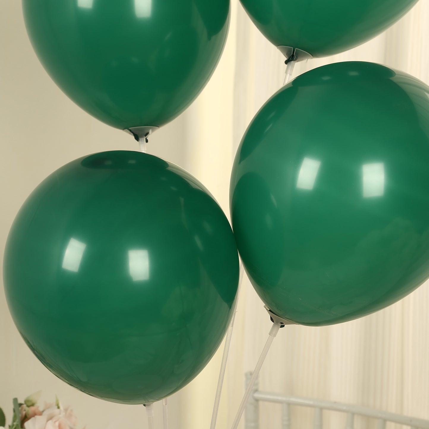 Matte pastel hunter emerald green biodegradable balloons, eco-friendly party decor.