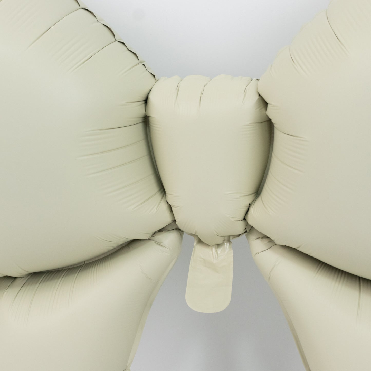Matte white giant decorative foil bow balloons for party styling.