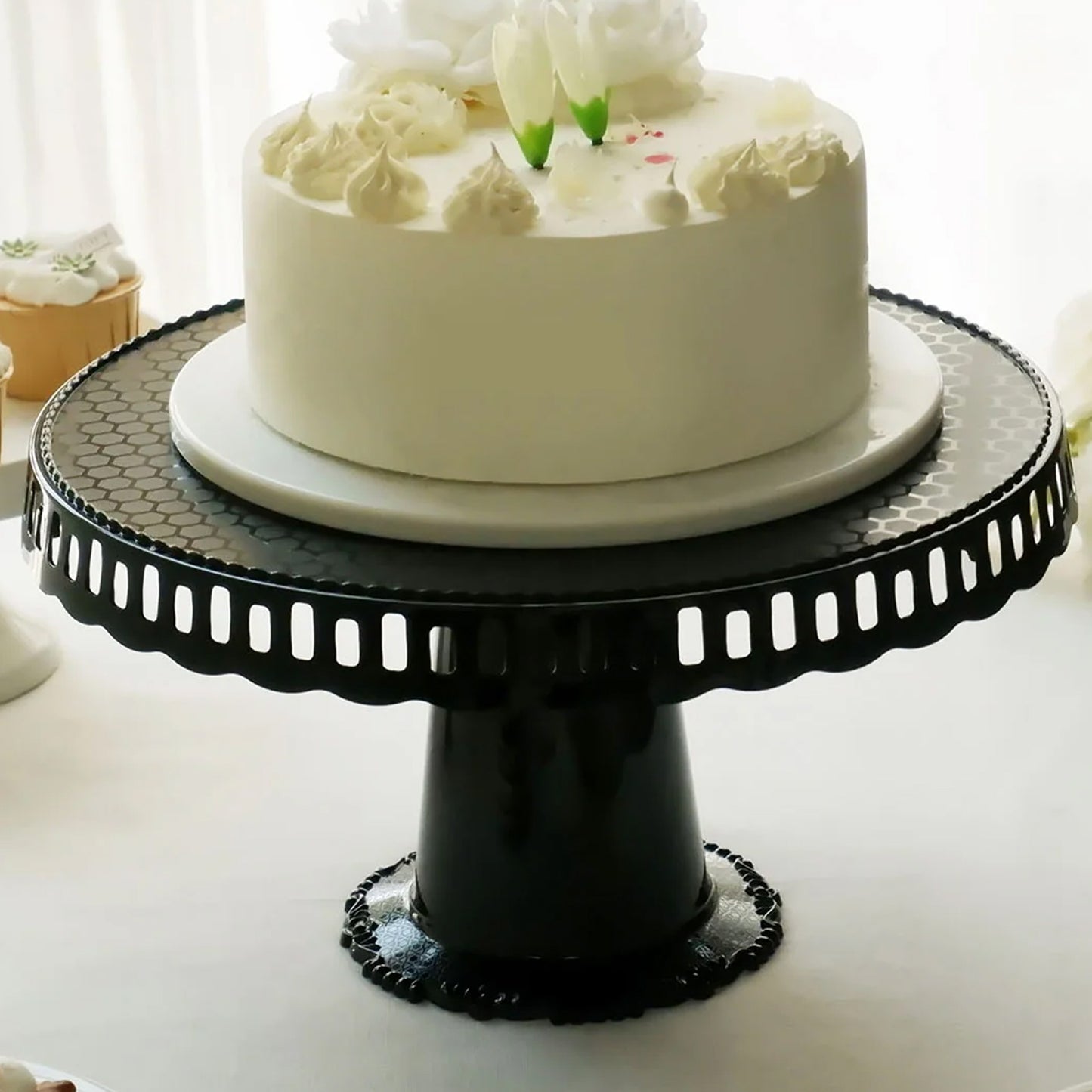 Black round pedestal cupcake stand with interchangeable ribbon trim.