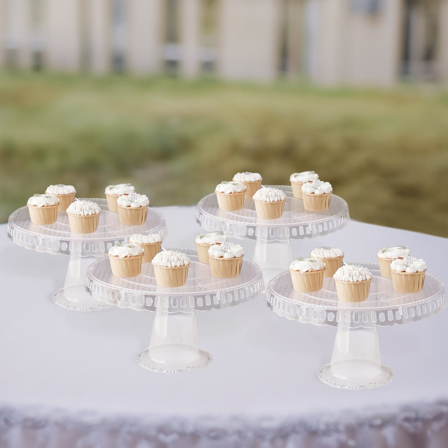 Clear round pedestal cupcake stands with interchangeable ribbon trim.