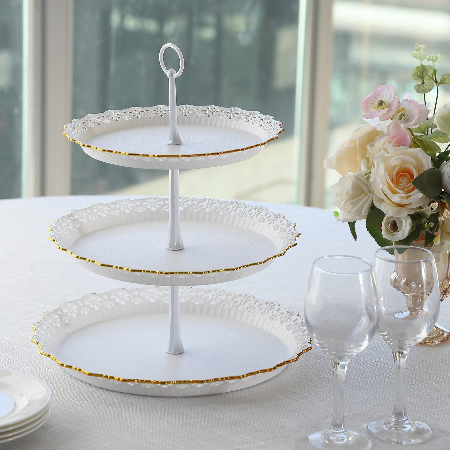 White 3-tier cupcake stand with gold rim and scalloped edges.