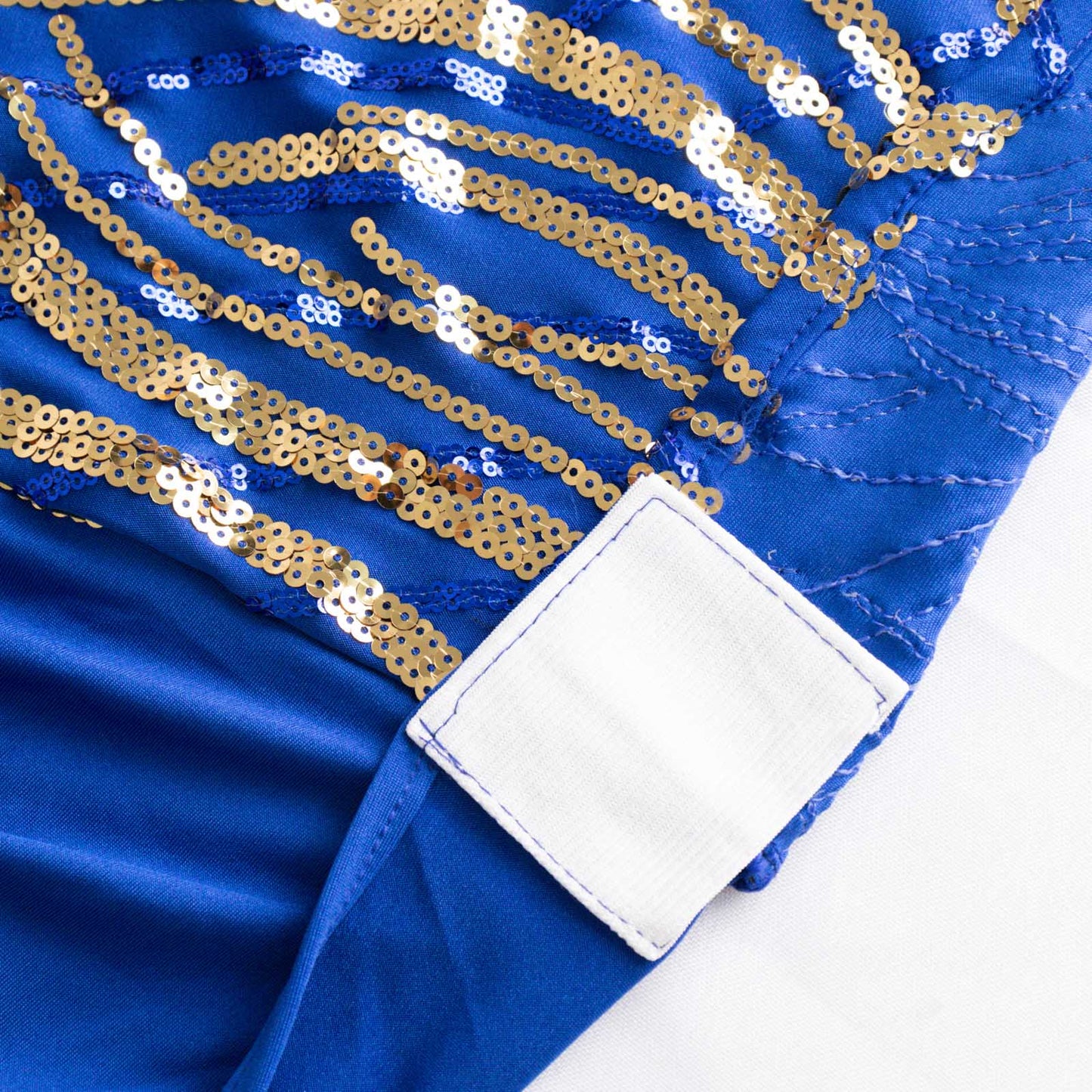 Royal blue banquet chair cover with gold sequined wave embroidery.