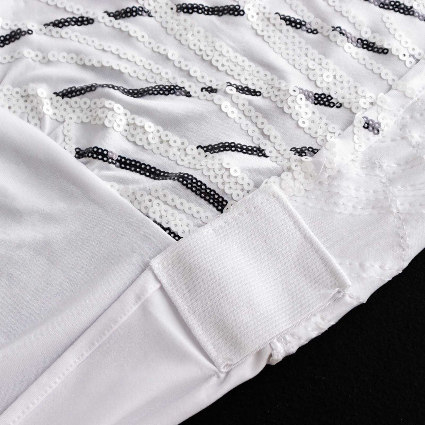 White spandex fitted banquet chair cover with wave sequins.