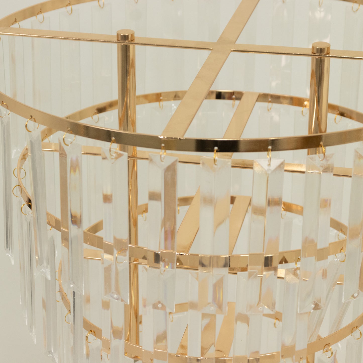 Gold crystal chandelier centerpiece with elegant hanging crystals.