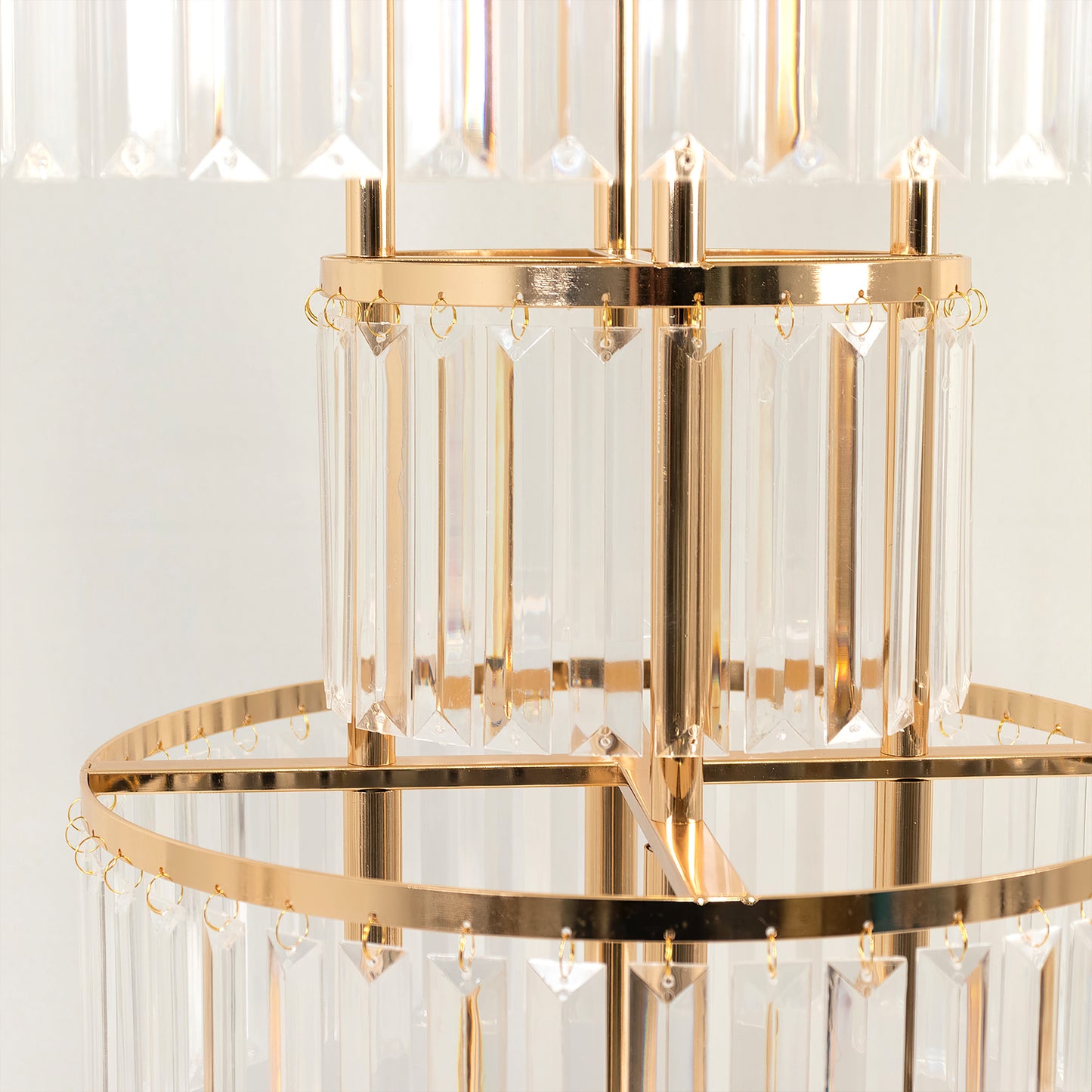 Gold crystal pendant table centerpiece with hanging crystals.