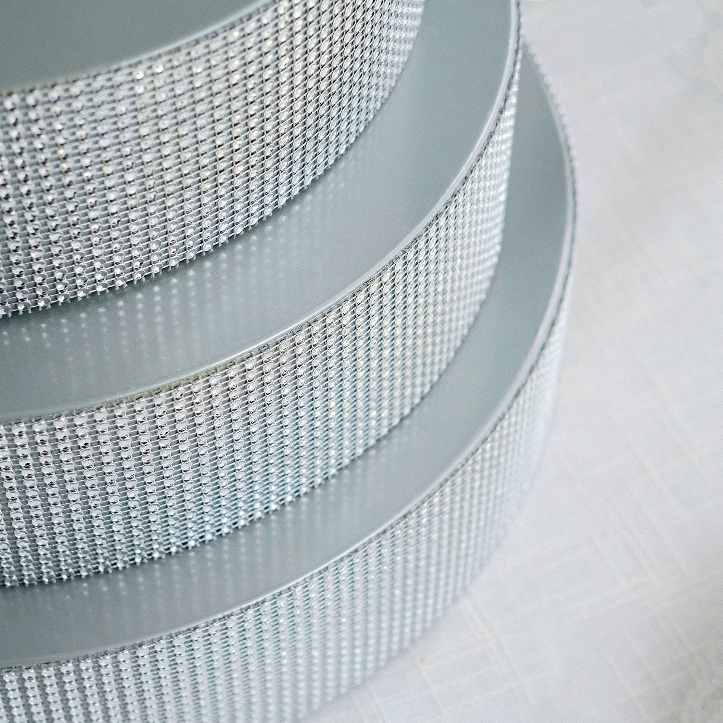 Silver rhinestone round metal pedestal cake stand.
