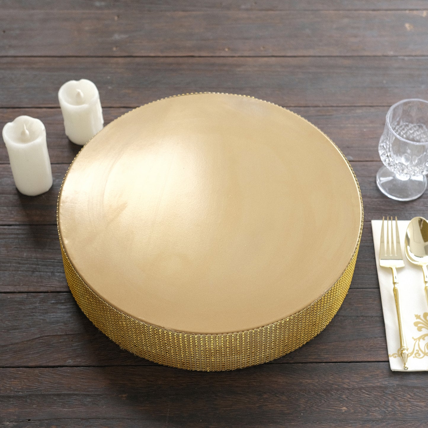Gold round metal pedestal cake stand with rhinestones, perfect for desserts.
