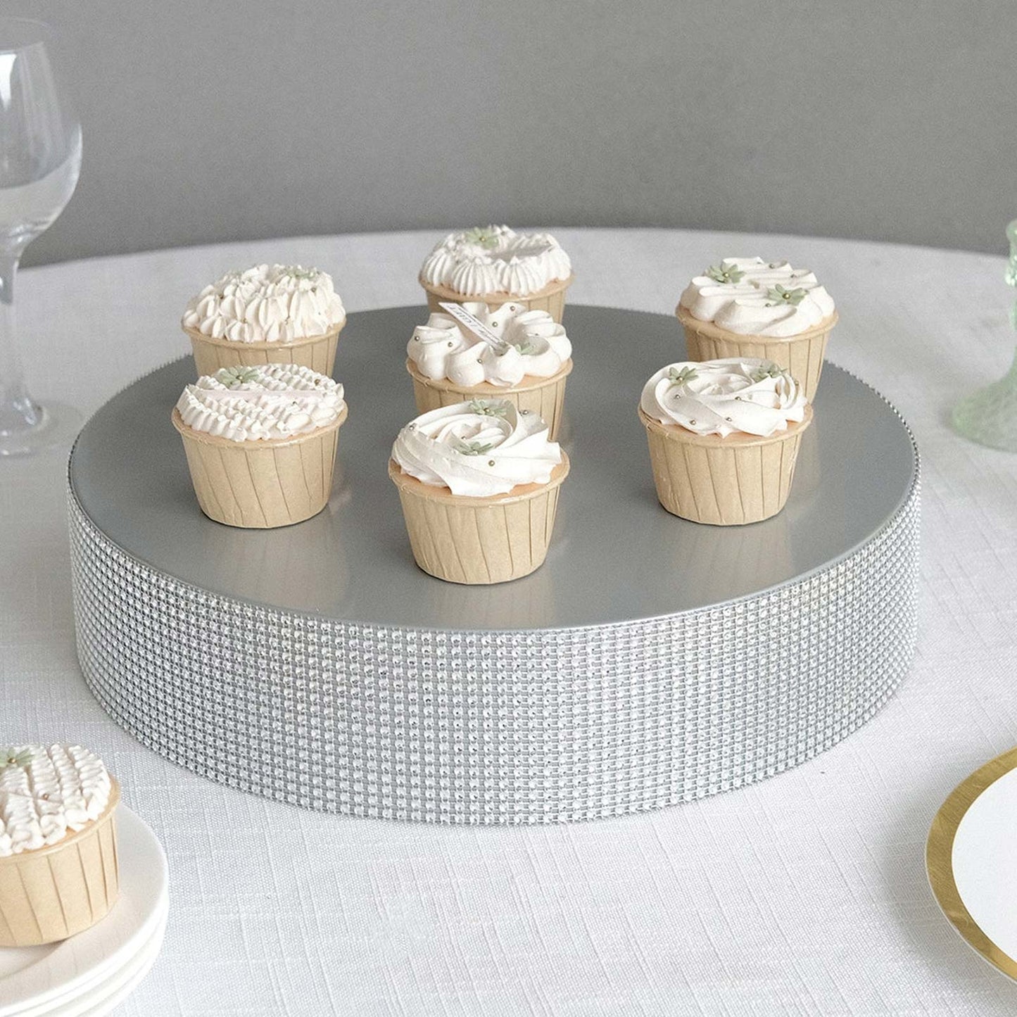 Silver rhinestone round pedestal cake stand with cupcakes.