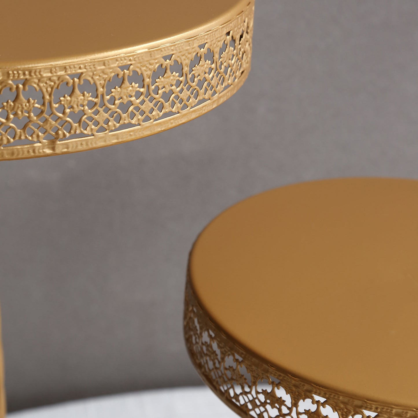 Gold 3-tier cake stand with hollow lace design for desserts and cupcakes.