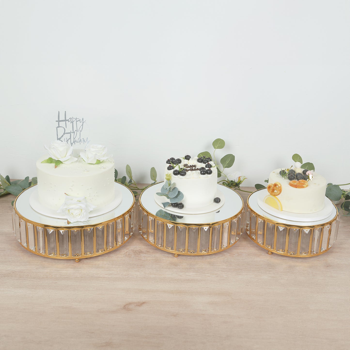 Gold metal crystal pendant cake stands with mirror tops, stackable round trays.