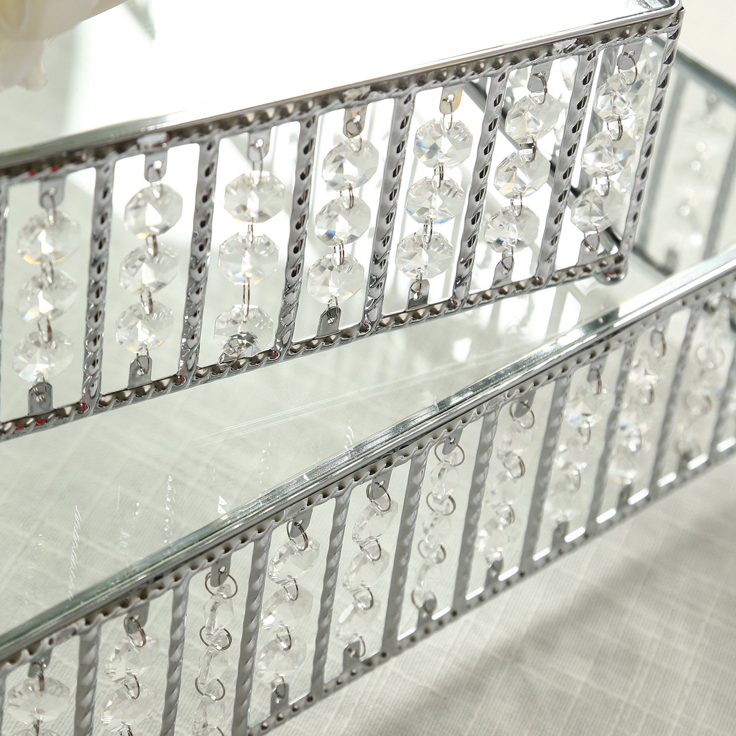 Silver cake stand with hanging crystal beads and glass top.