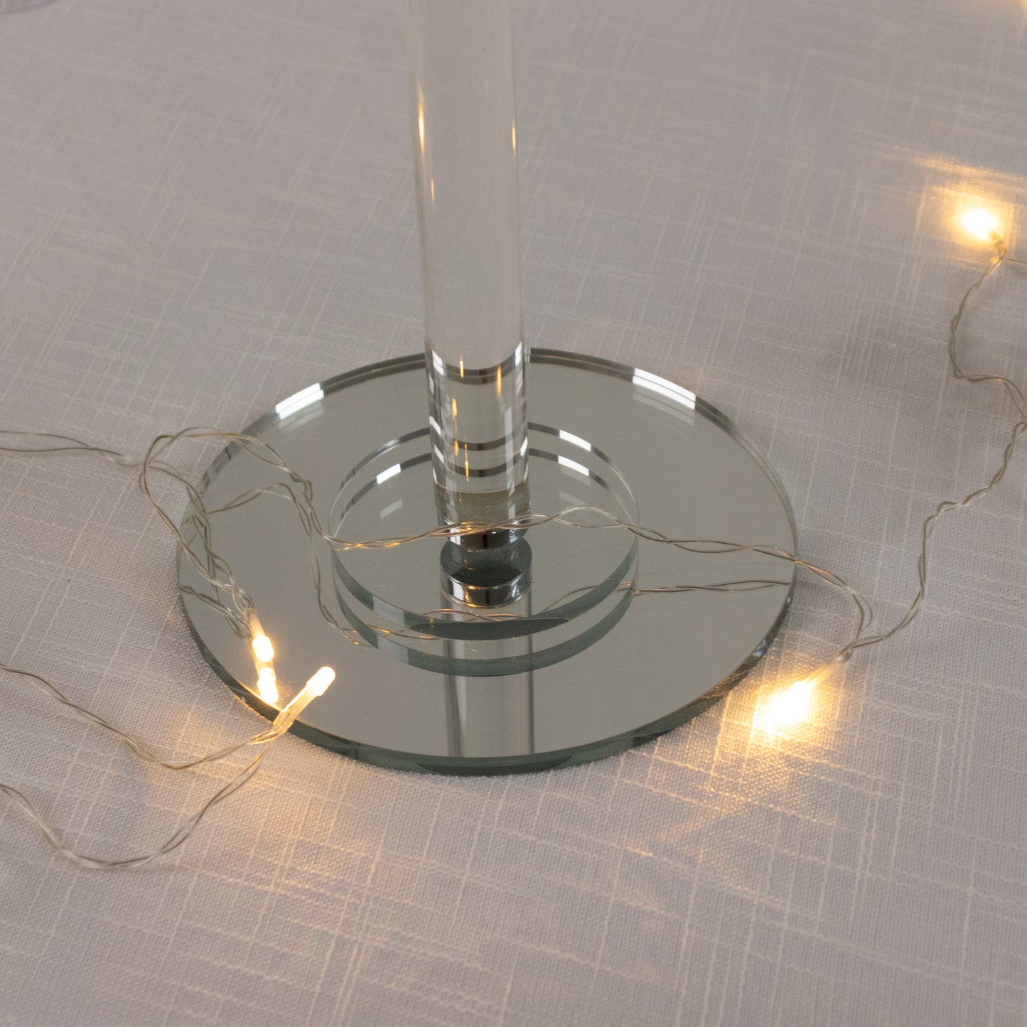 Clear acrylic crystal candle lamp with ribbed shade and tealight holder.