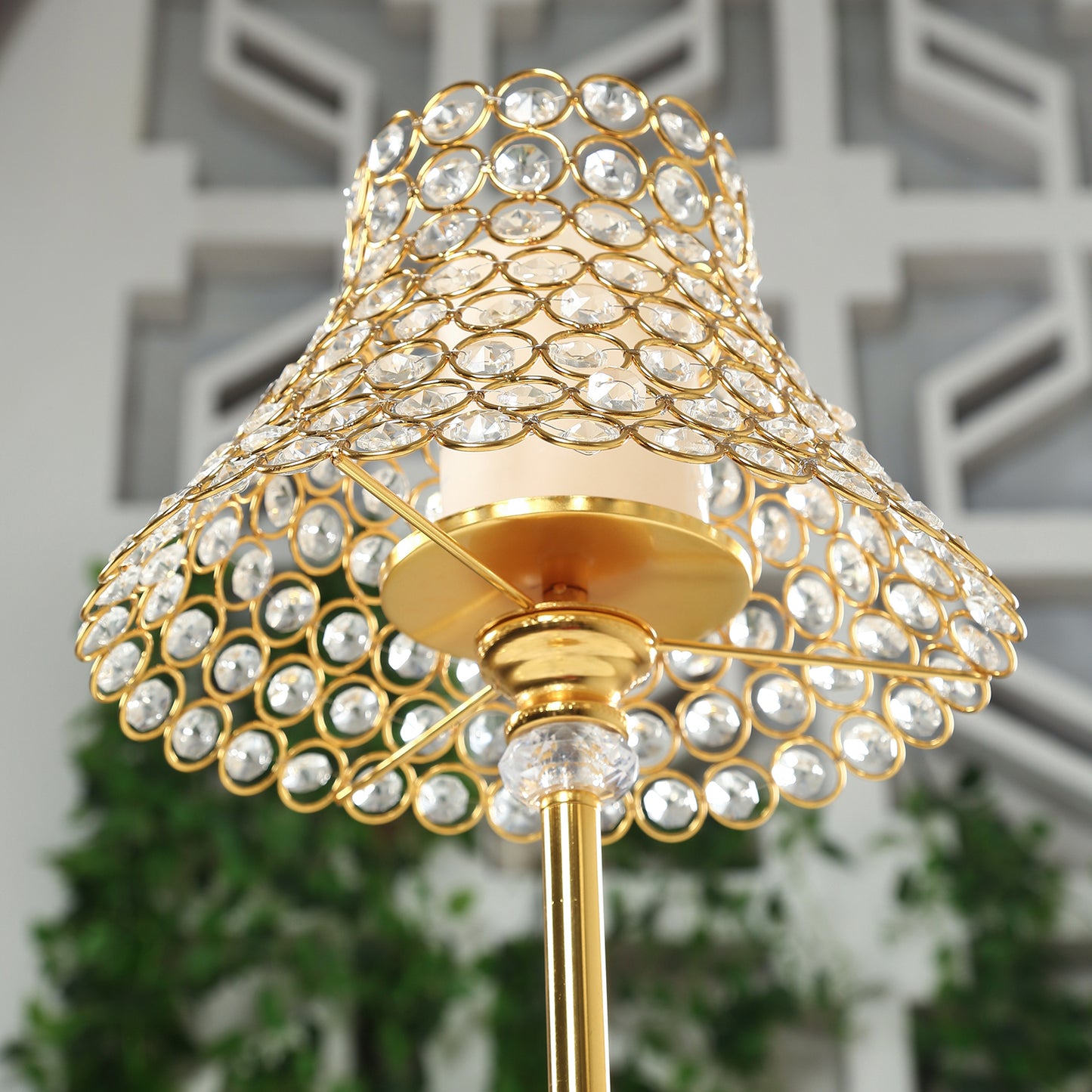 Gold crystal beaded candle stand with lamp-inspired shade.