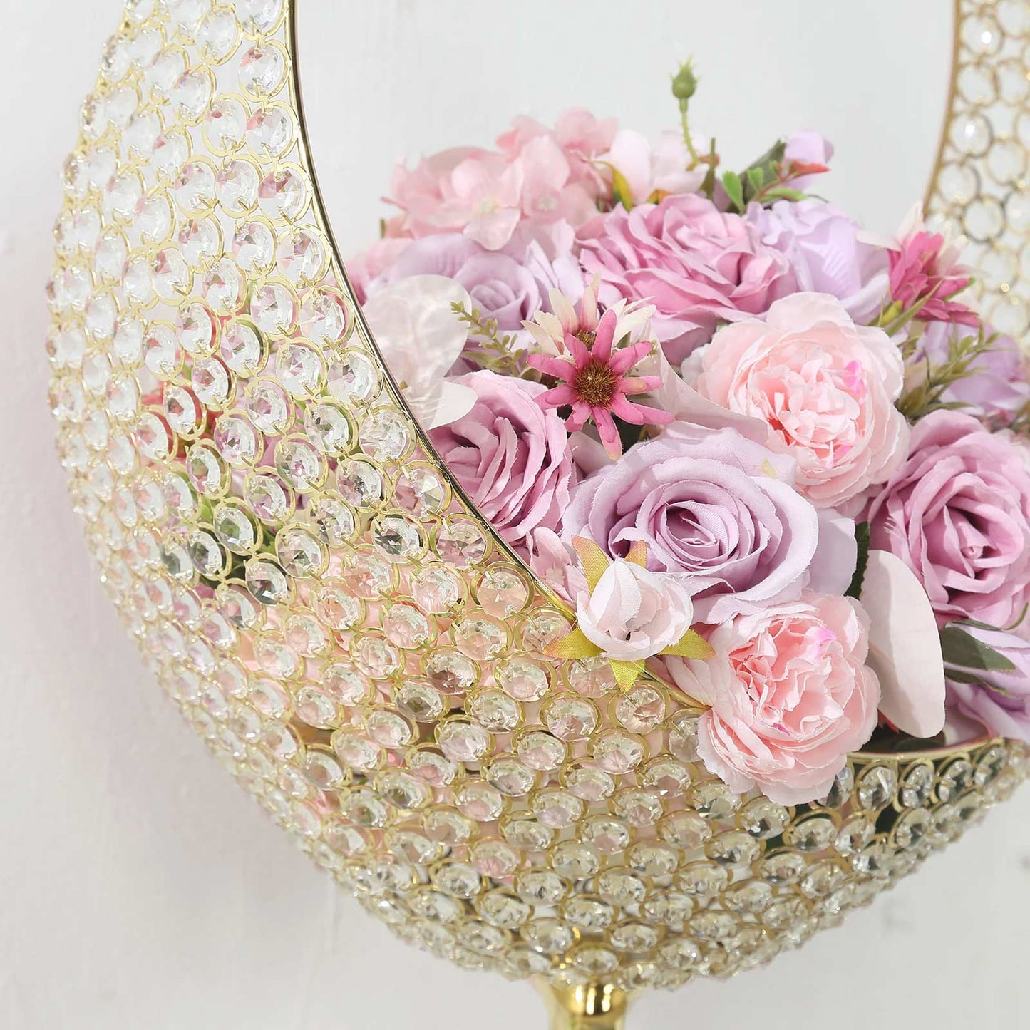 Gold crystal beaded flower stand with pink floral arrangement.