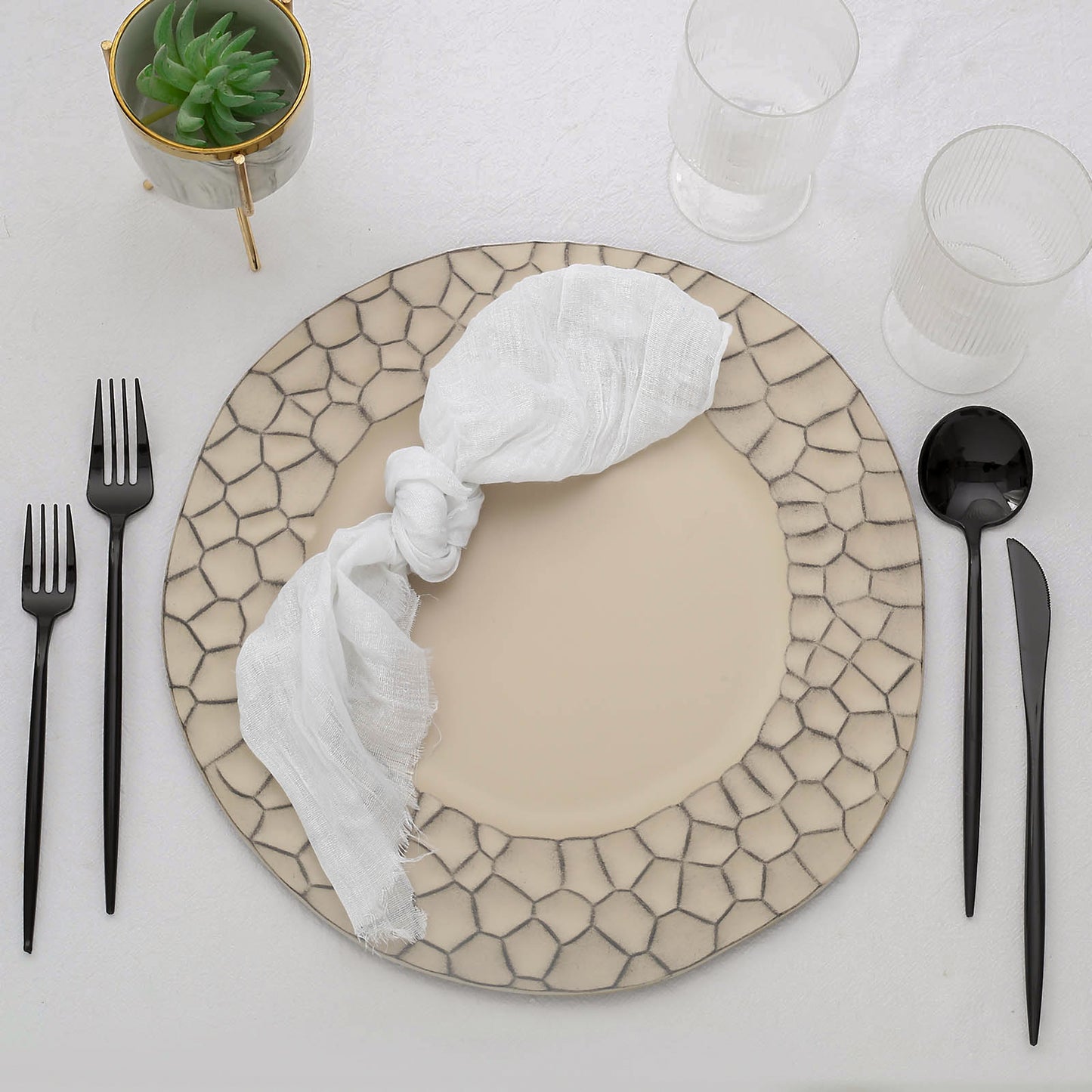 Matte finish taupe hammered charger plate with modern design.