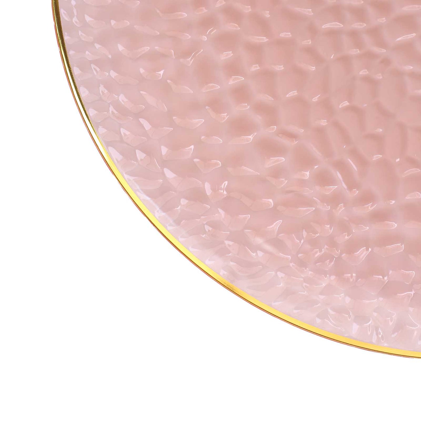 Transparent blush hammered charger plate with gold rim.