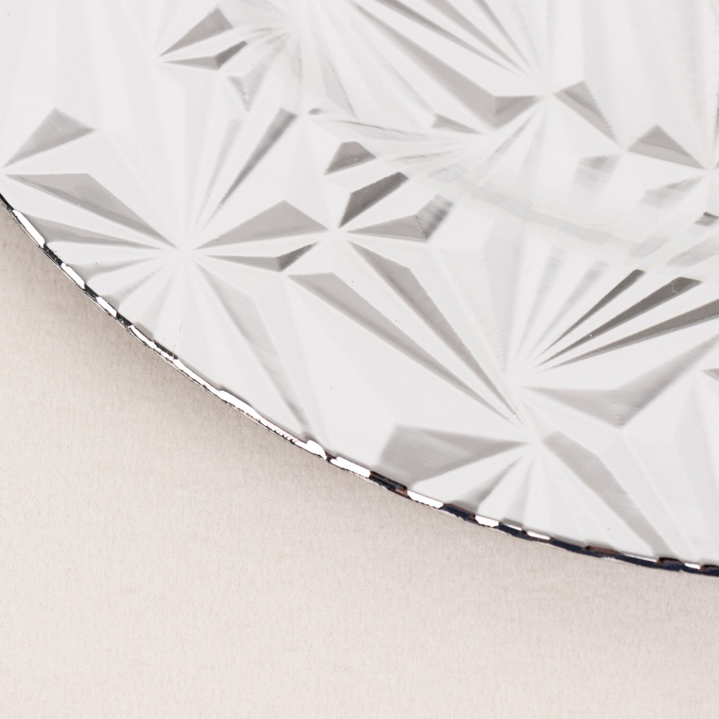 Metallic silver rock cut acrylic charger plate, decorative serving dish.
