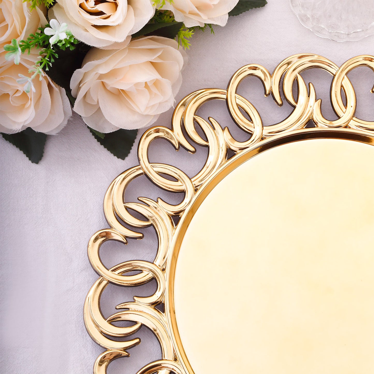 Gold disposable charger plate with entwined swirl rim, 13" round.