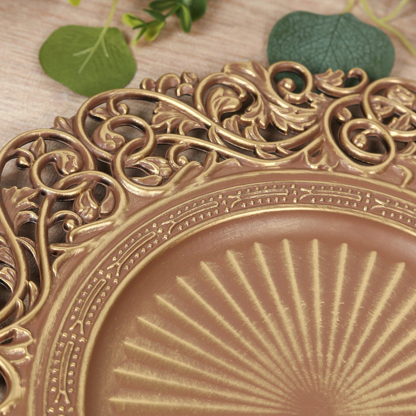 Brown charger plate with vintage floral carved rim and brushed gold accents.