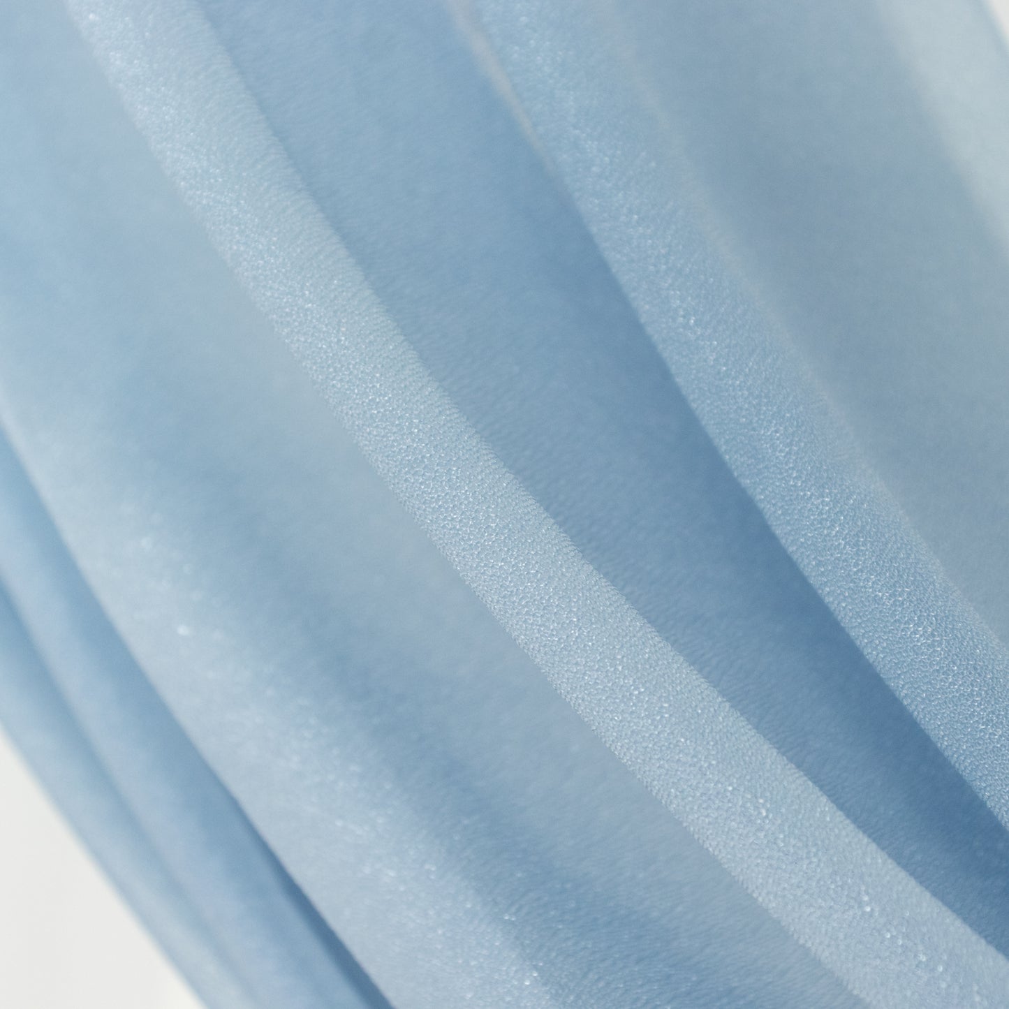Dusty blue sheer backdrop drape for wedding arch and ceiling decor.