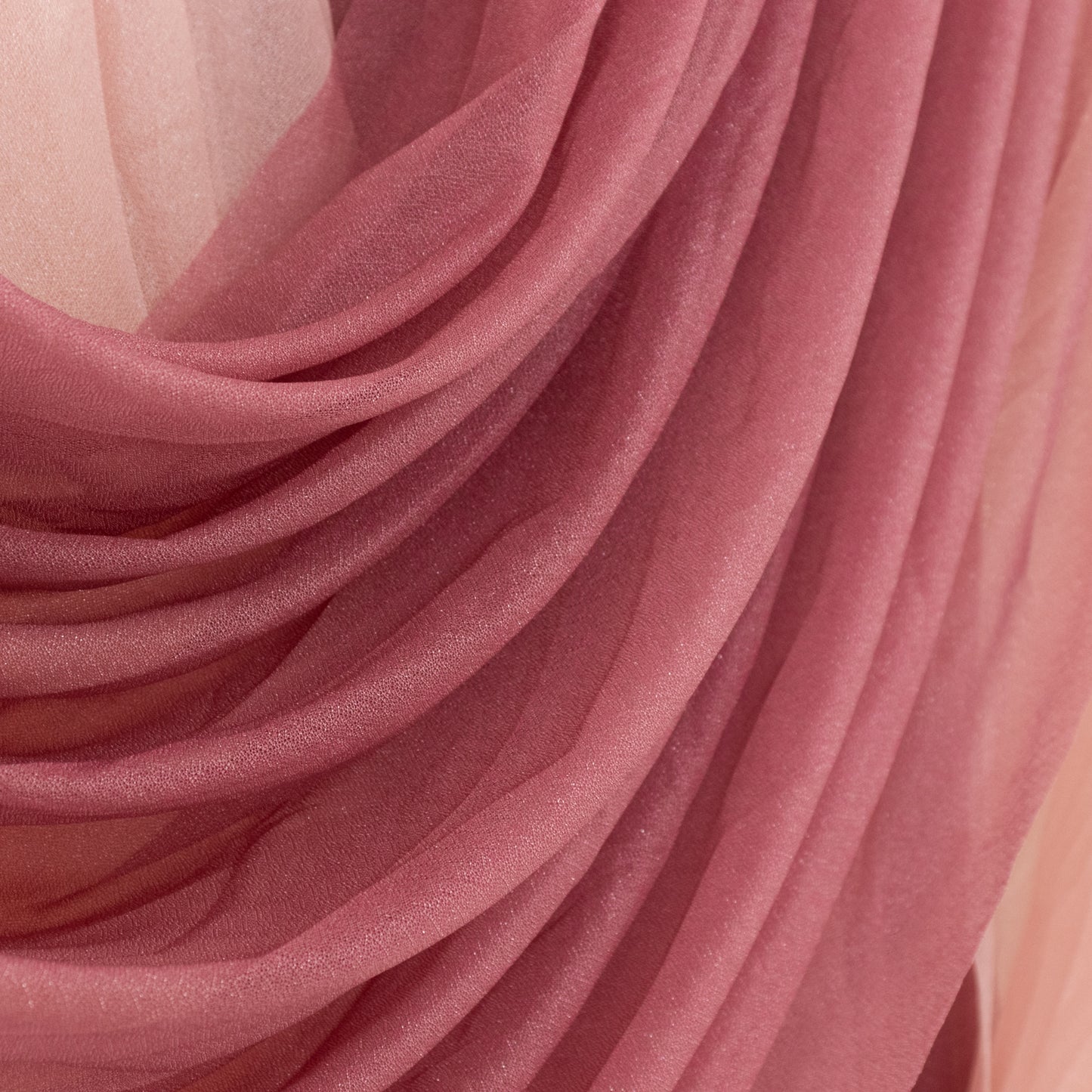Mauve chiffon backdrop valance drapes with elegant curved swag design.