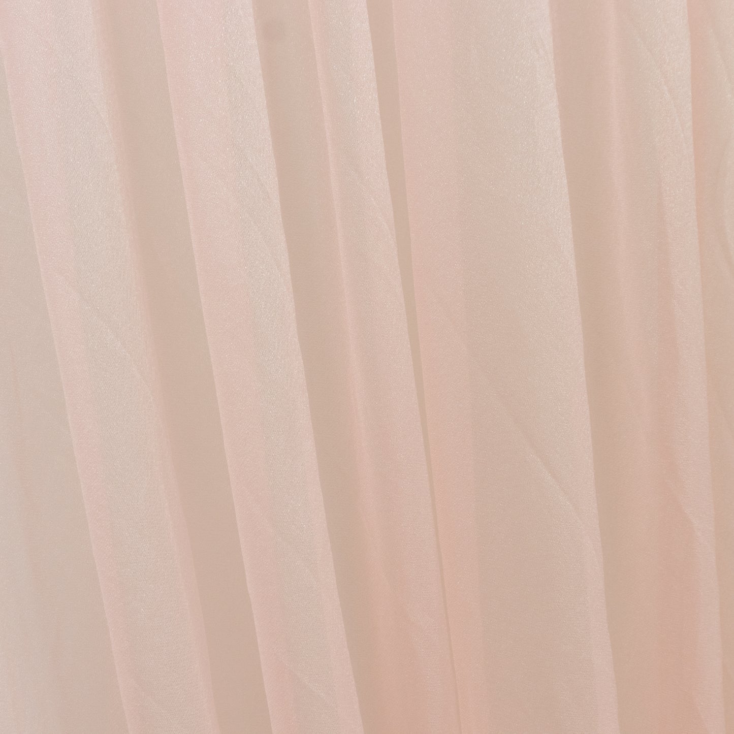 Blush sheer chiffon curtain drape for wedding arch and decor.