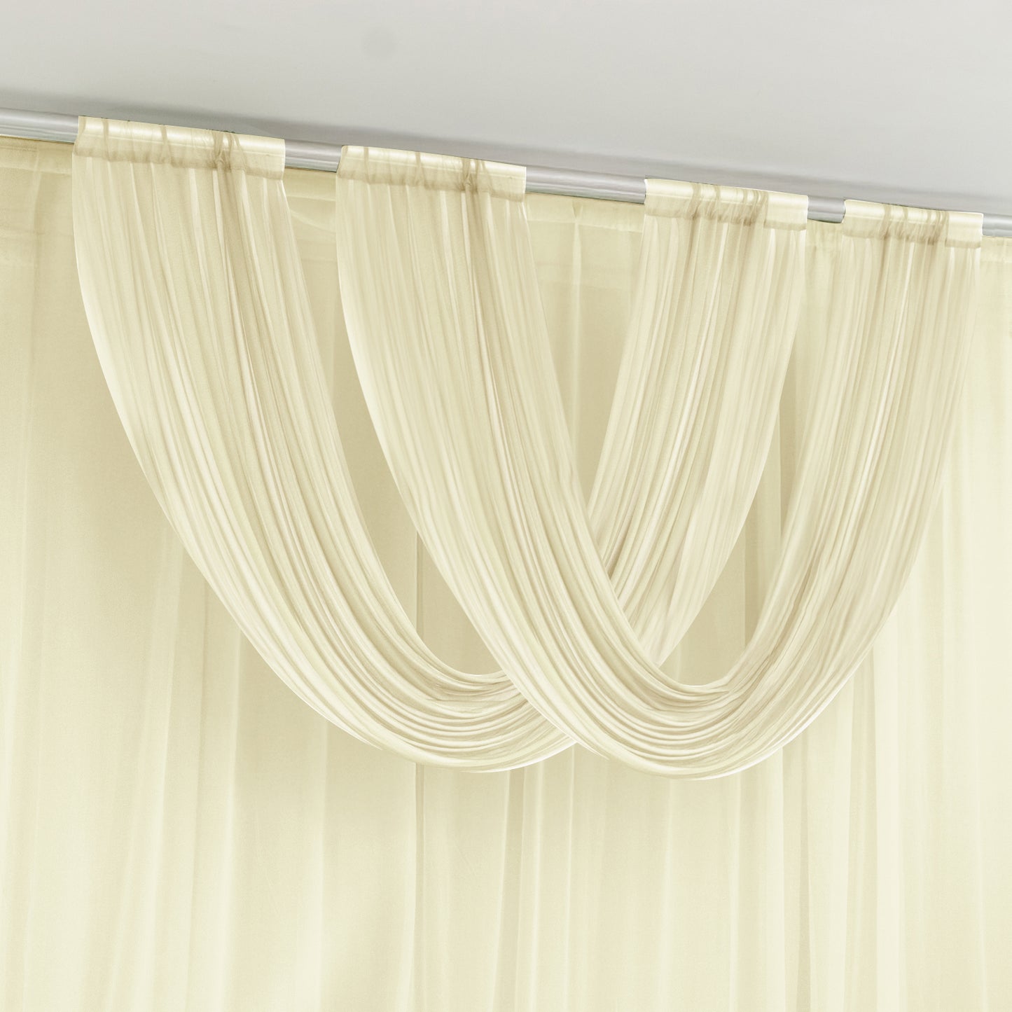 Beige sheer chiffon valance curtain draped elegantly on a rod.