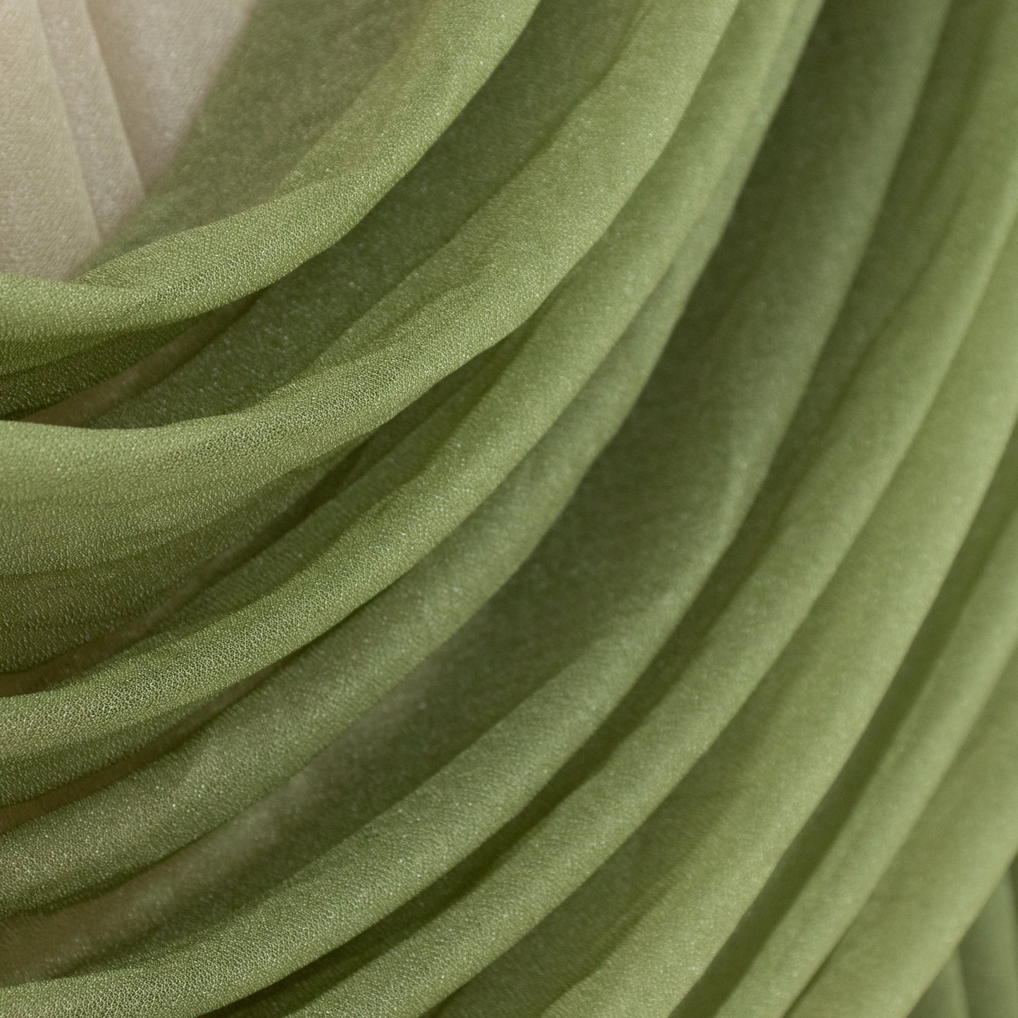 Dusty sage green sheer chiffon valance curtain draped elegantly.