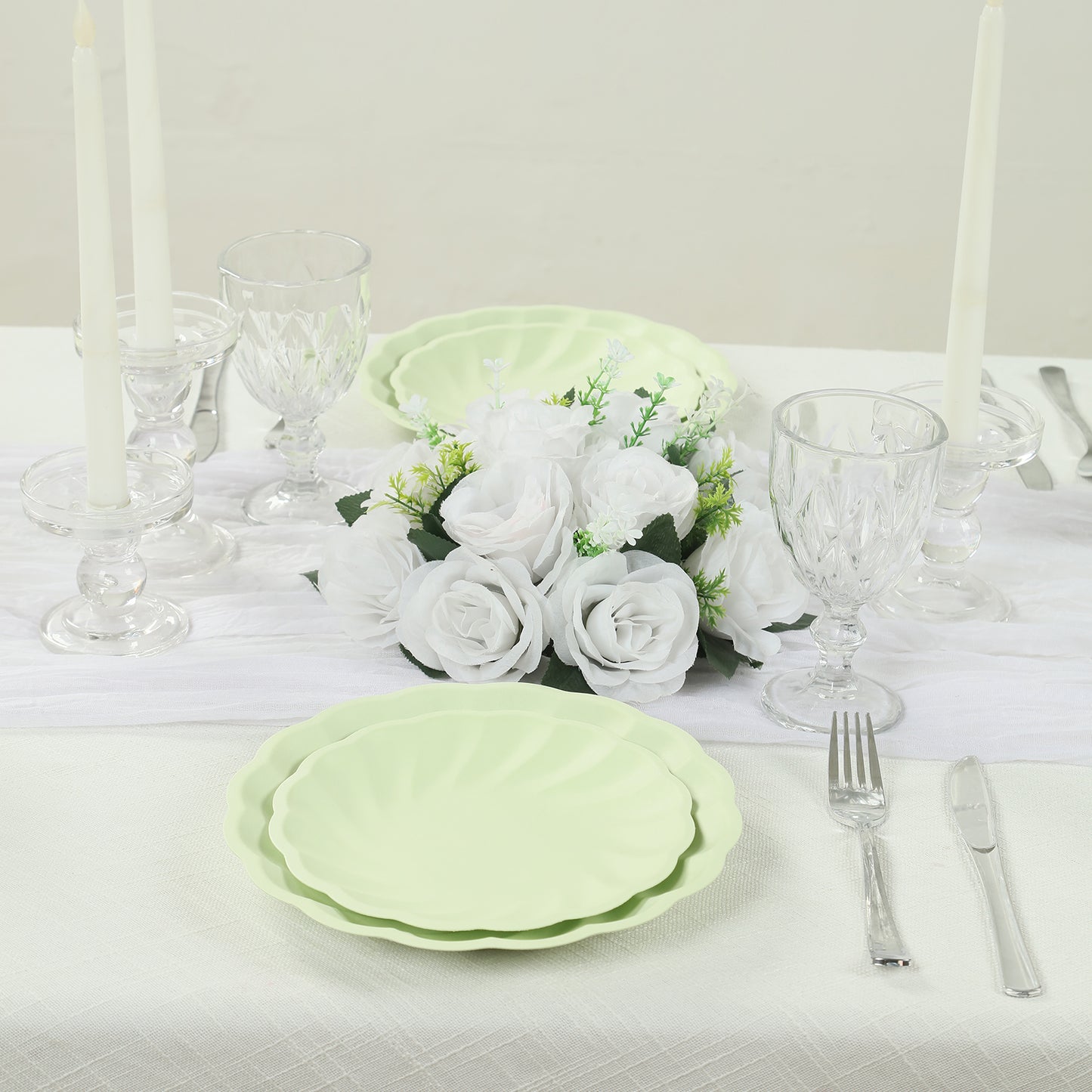 Sage green biodegradable salad plates in elegant table setting.
