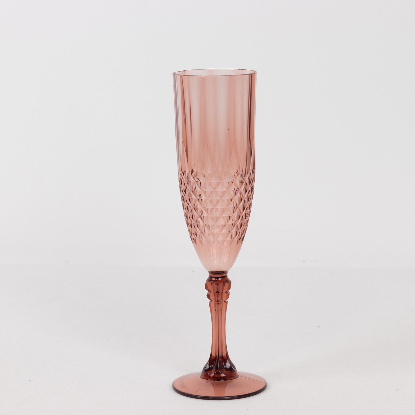Dusty rose shatterproof champagne flute glass for wedding toasts.