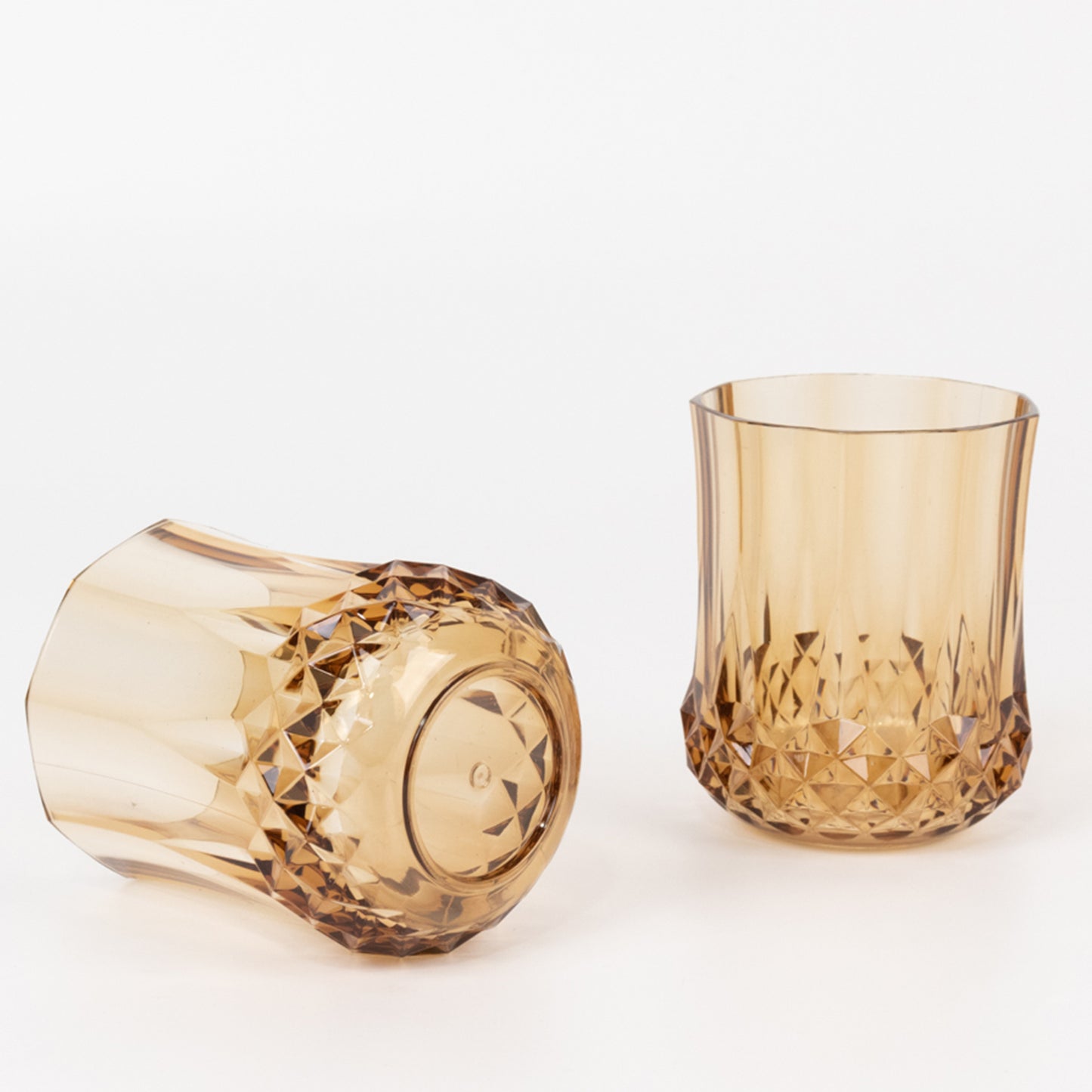 Amber gold stemless wine glasses, shatterproof and reusable, ideal for whiskey.