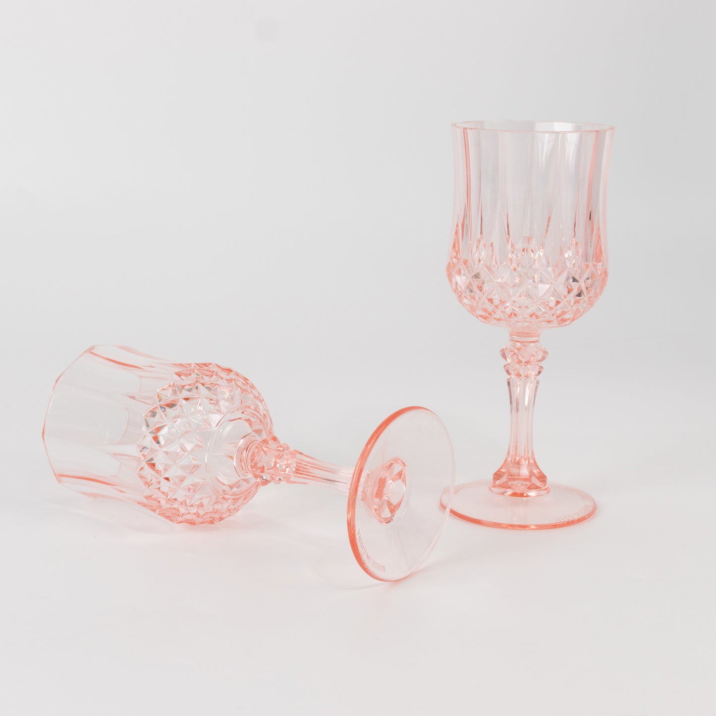 Transparent blush crystal cut cocktail goblets, shatterproof wine glasses.