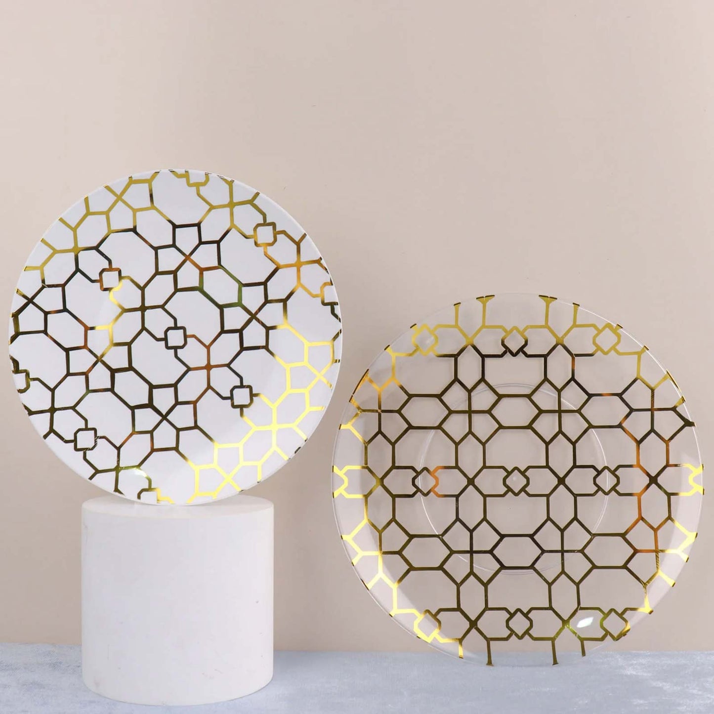 White and clear geometric gold print disposable plastic plates set.