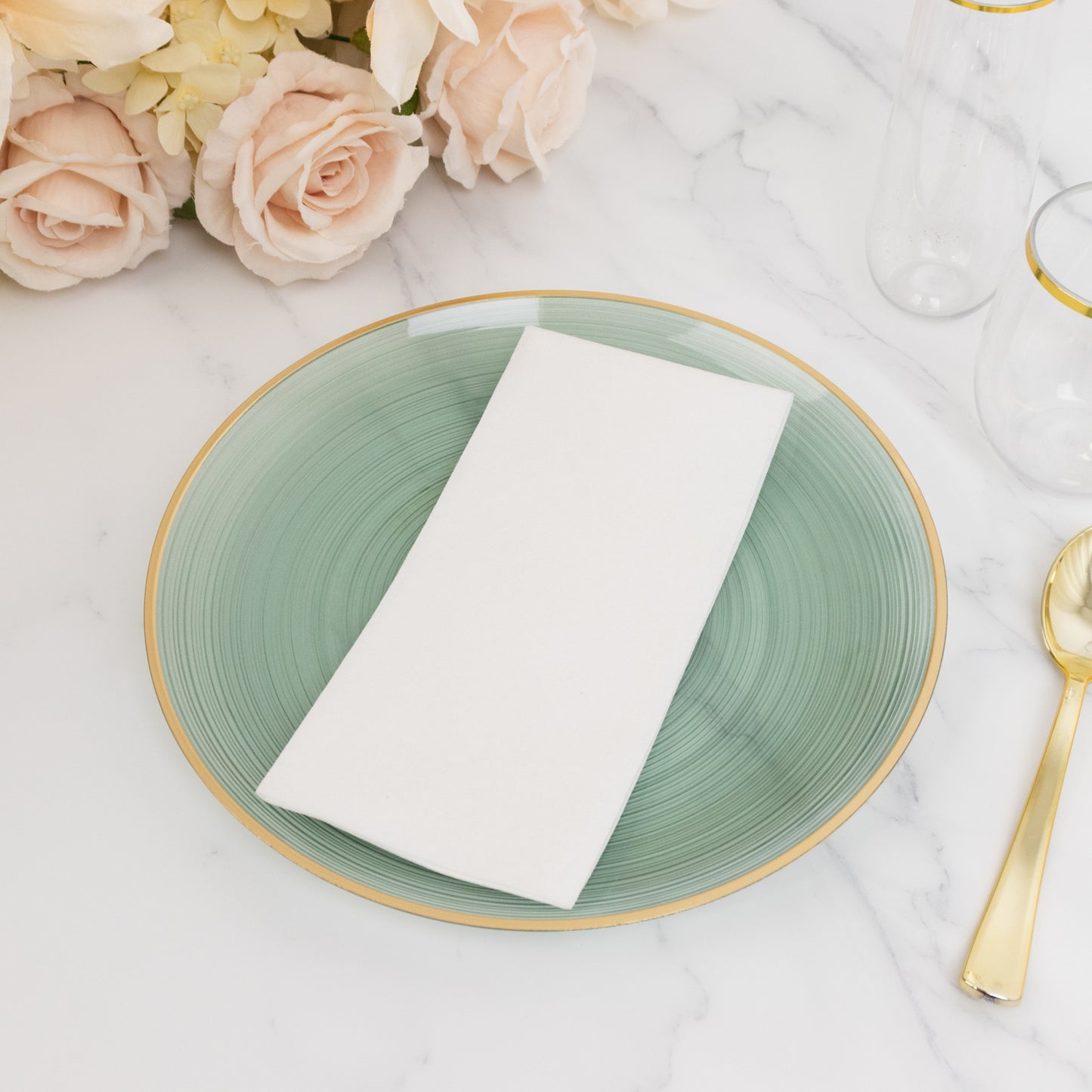 10" Transparent Dusty Sage Green Swirl Plate with Gold Rim on a marble table.