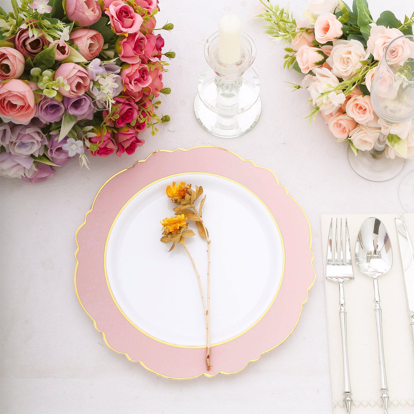 Blush white disposable dinner plate with gold rim and floral decoration.