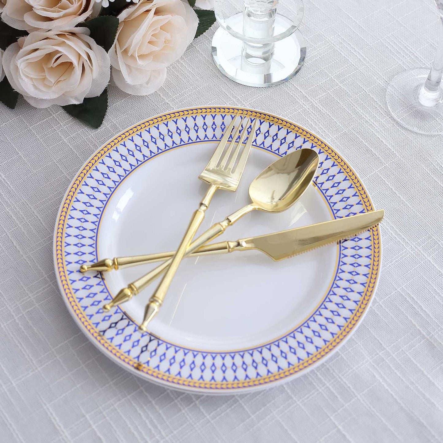 White round disposable dinner plate with gold and navy blue rim.