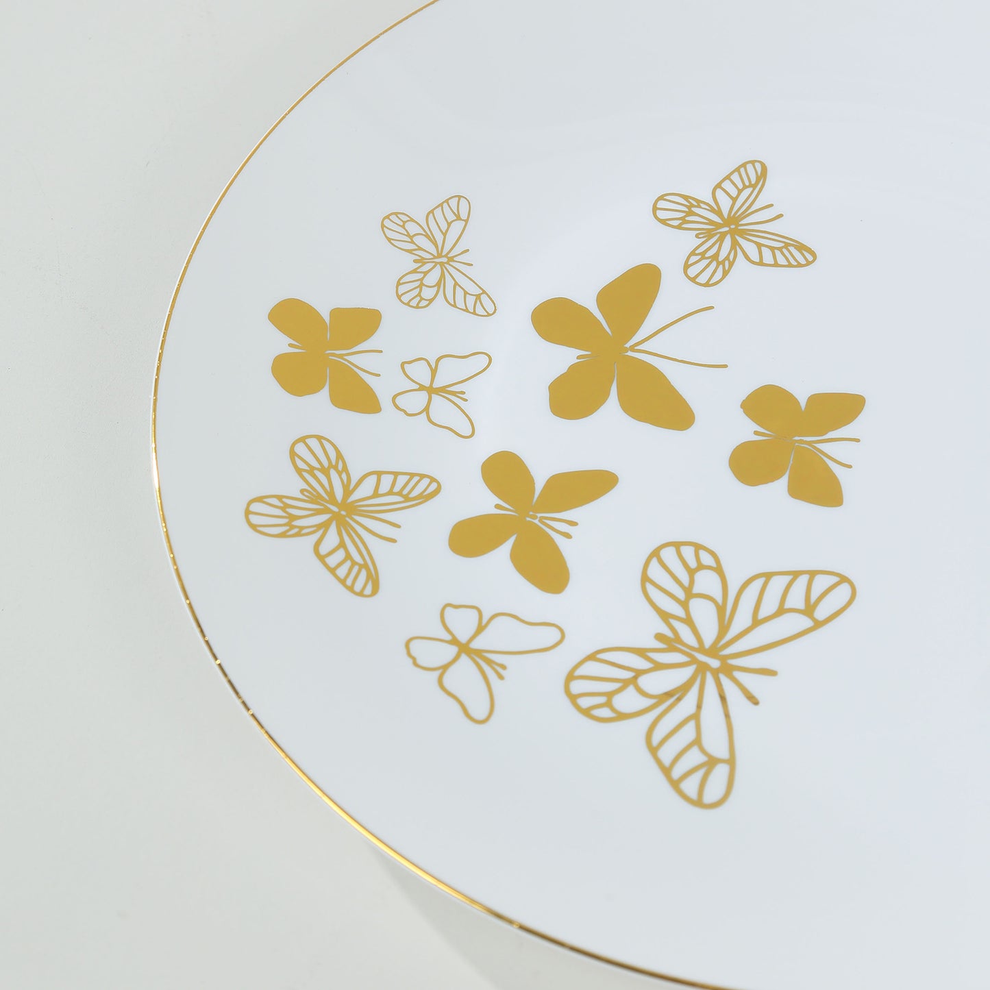 White gold butterfly disposable plates with gold rim, 10" and 8" sizes.
