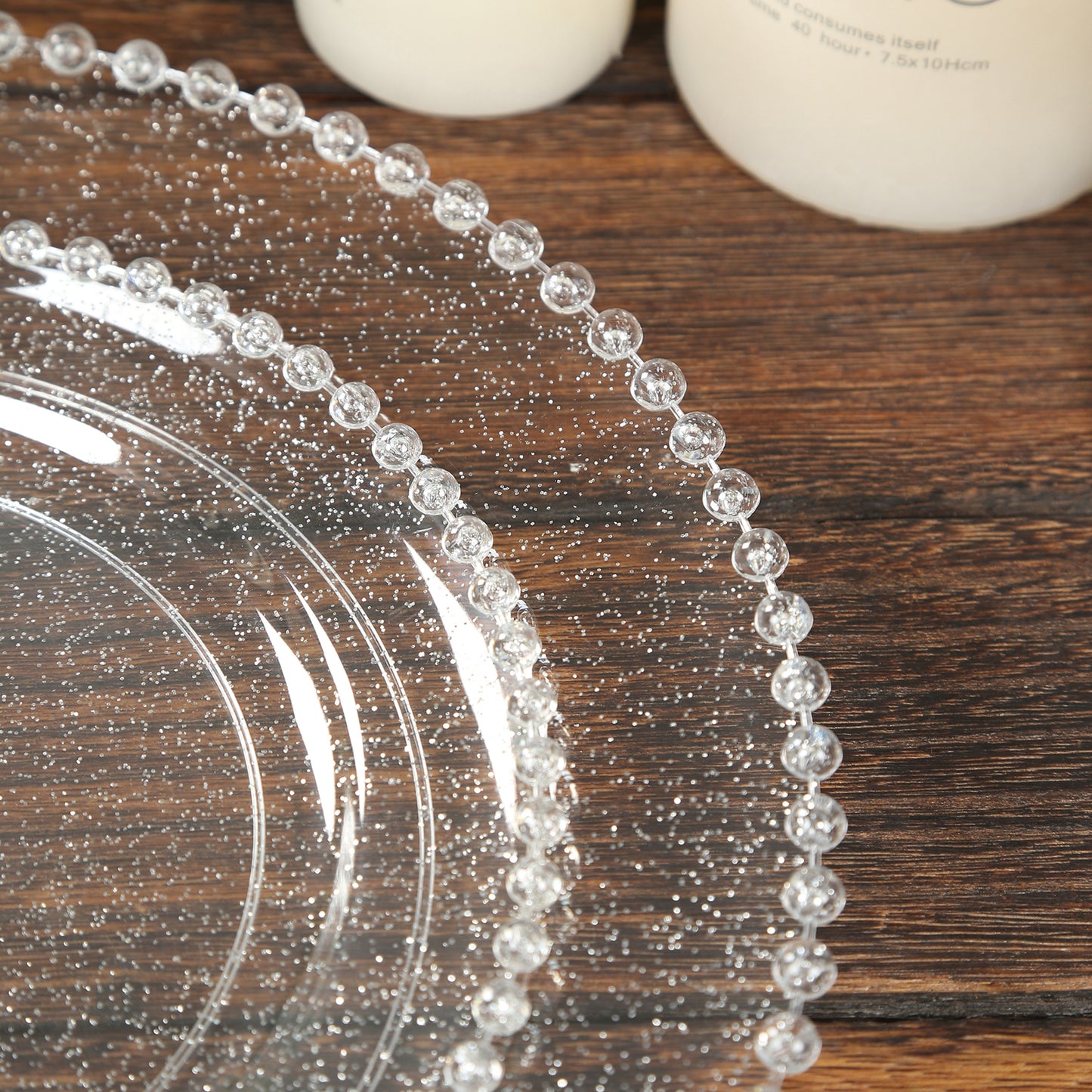 Clear silver glittered round dinner plates with beaded rim.
