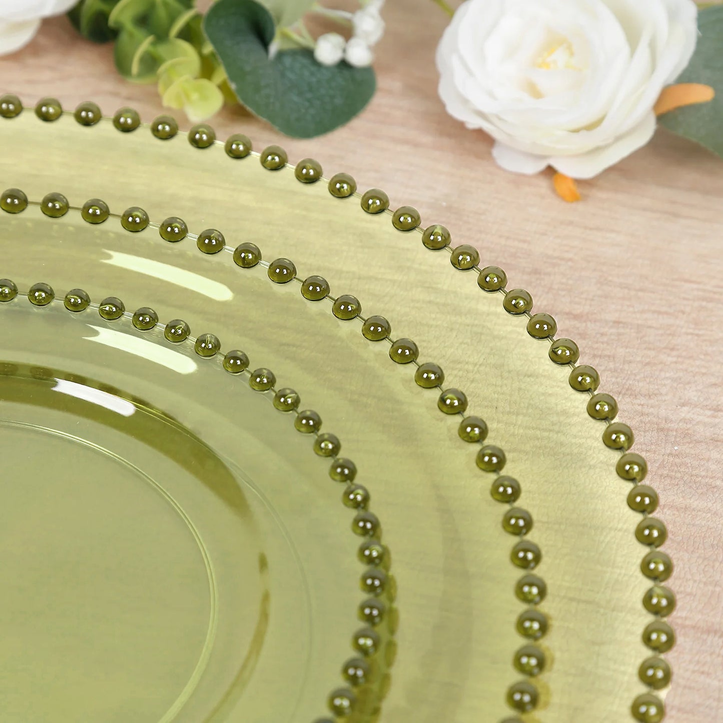Transparent dusty sage green round dinner plate with beaded rim.